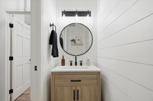 The floating shelf in the mirror is included with the home.