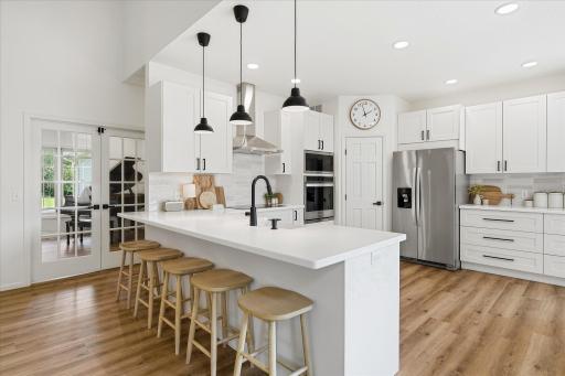 Wow. This stunning & upgraded kitchen is simply irresistable. Let's go in there and check out all the details, shall we? Pull up a seat at the 115" peninsula.