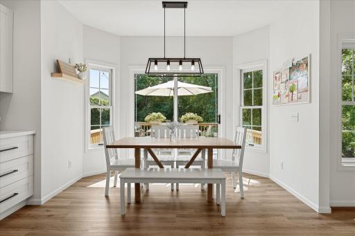 The luxury vinyl plank flooring is easy to clean up after dinner - even if you have toddlers at the table!