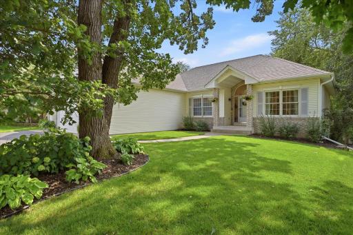 The front yard - and the rest of the property for that matter - features tasteful landscaping with fresh mulch.