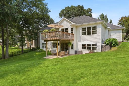 From here, you can see that the gutter downspouts do an excellent job of getting rainwater away from the home, and you can also see the walk-through rear door of the garage. The door is new as of this year as well!