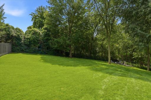 The private & well-manicured back yard is beautiful.