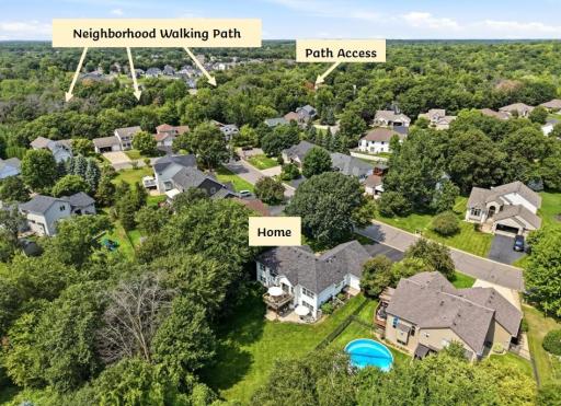 There is a paved walking path that winds through the neighborhood. Notice the mature tree cover in the back yard!