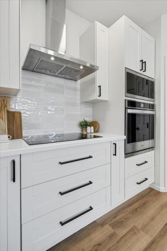 Right next to the cooking station, you will enjoy cabinets made for cooking utensils, pots & pans - a triple stack of 10" deep drawers under the cooktop and another double stack under the wall oven!