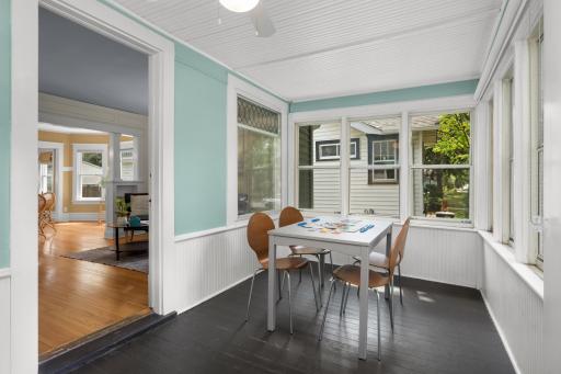 Glazed front porch provides additional living space three seasons