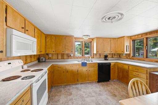 Large open kitchen with built-in microwave and dishwasher.