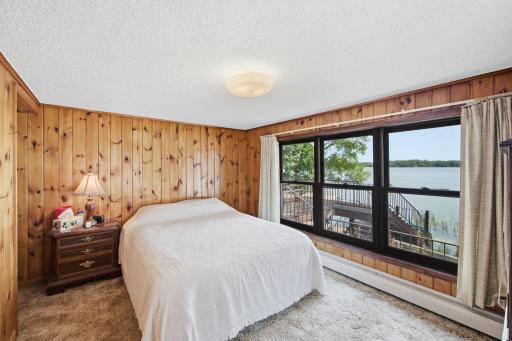 Bedroom 1 on main level overlooking lake
