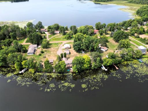 1.3 acres, main house, secondary 1-bedroom cabin, smaller building, 4-car garage, and 2+ car garage!
