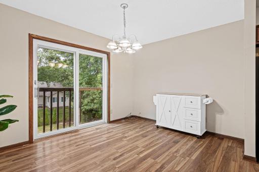 Dining overlooks backyard.