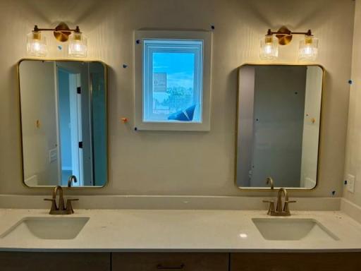 Double bowl primary bathroom with framed mirrors.jpg
