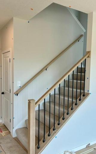 Oak railing going up to the second floor.jpg