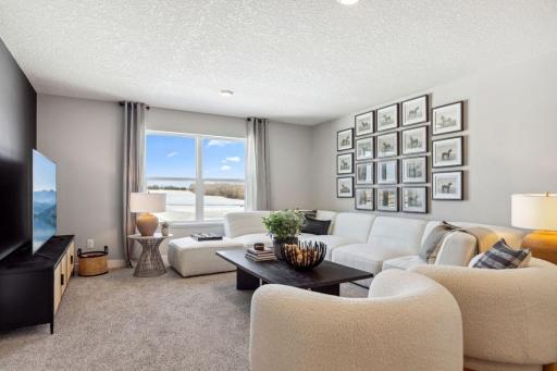 Once upstairs, the entire level flows from the focal point offered by this huge loft space. Sure to become a family favorite hangout spot! Photo of a model home, color & options will vary.