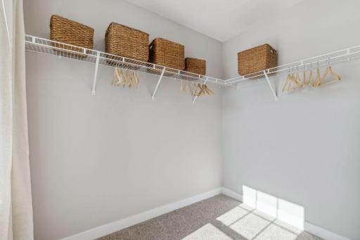 Each of the home's three secondary upper-level bedrooms are spacious, and each have immediate access to their own bath - two of which share a Jack and Jill! Photo of a model home, color & options will vary.