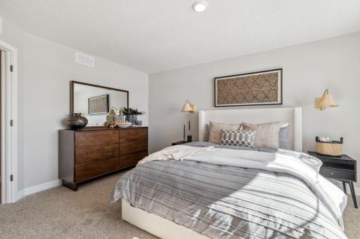 The 3rd secondary upper-level bedroom is the most spacious, and has it's own 3/4 bathroom (not attached).Photo of a model home, color & options will vary.