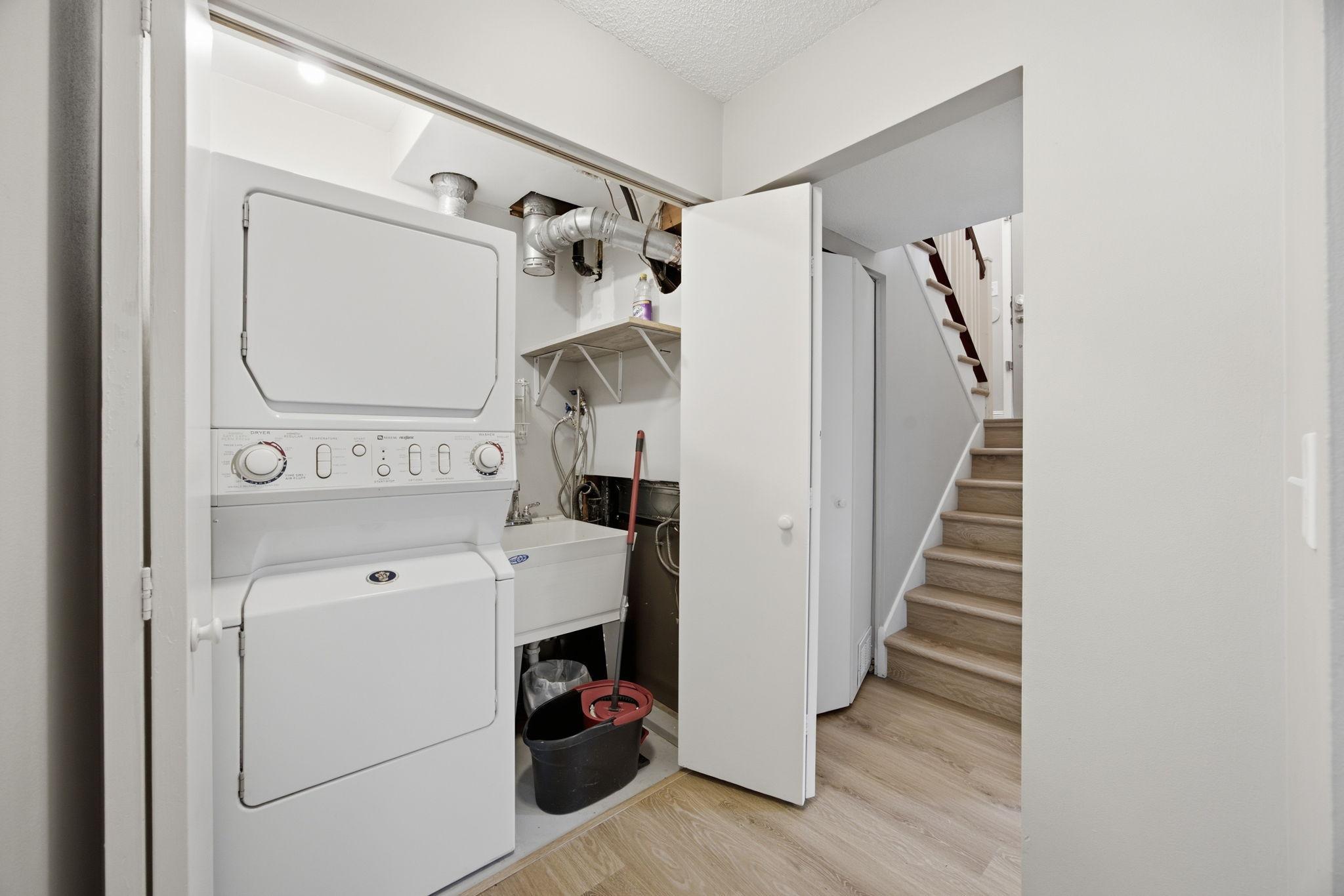 In-unit washer/dryer set is conveniently located near the bedrooms.