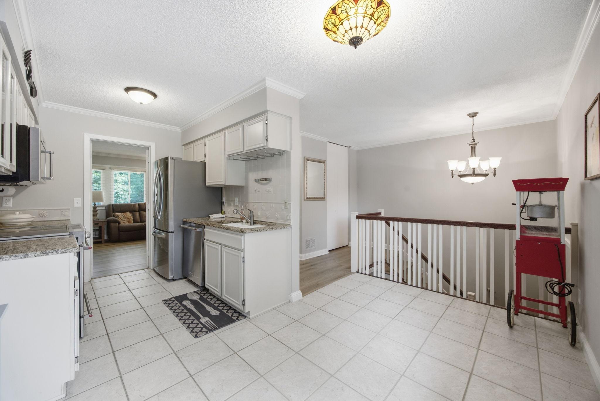 The kitchen features granite countertops.