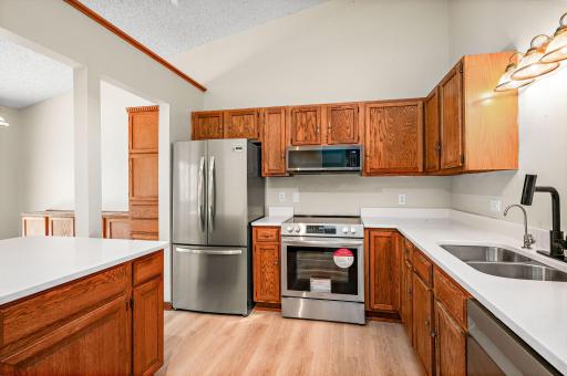 Kitchen with new SS appliances.