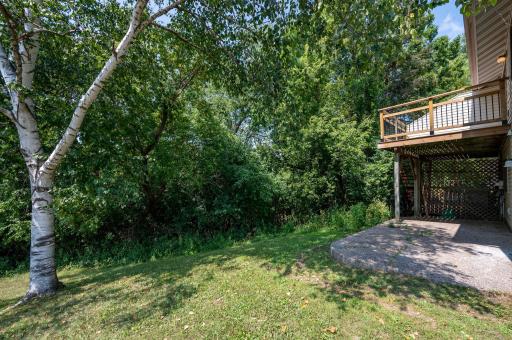 Deck and patio overlooking backyard.