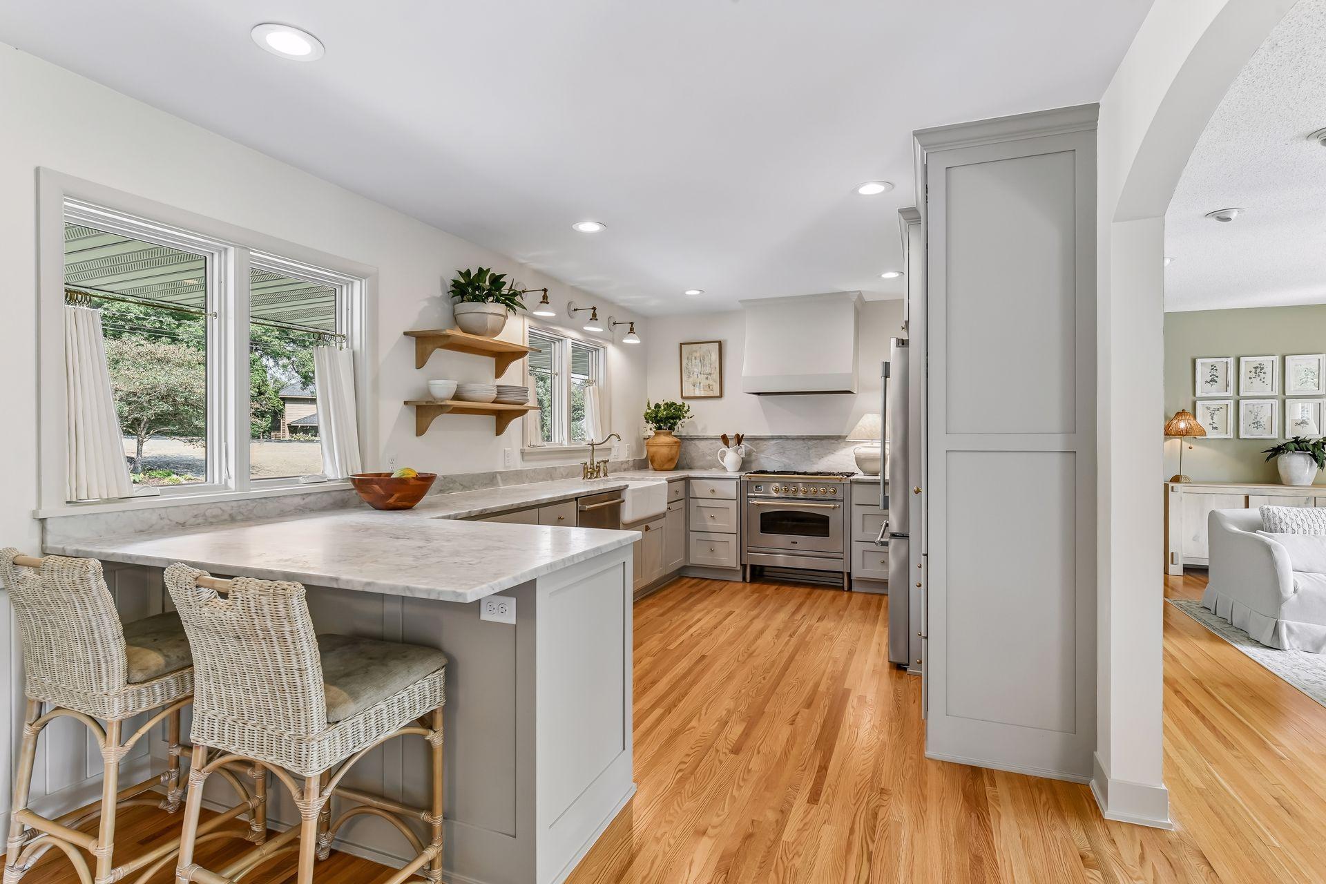 Step inside to a newly remodeled eat-in kitchen featuring marble countertops, high end appliances and custom cabinetry.
