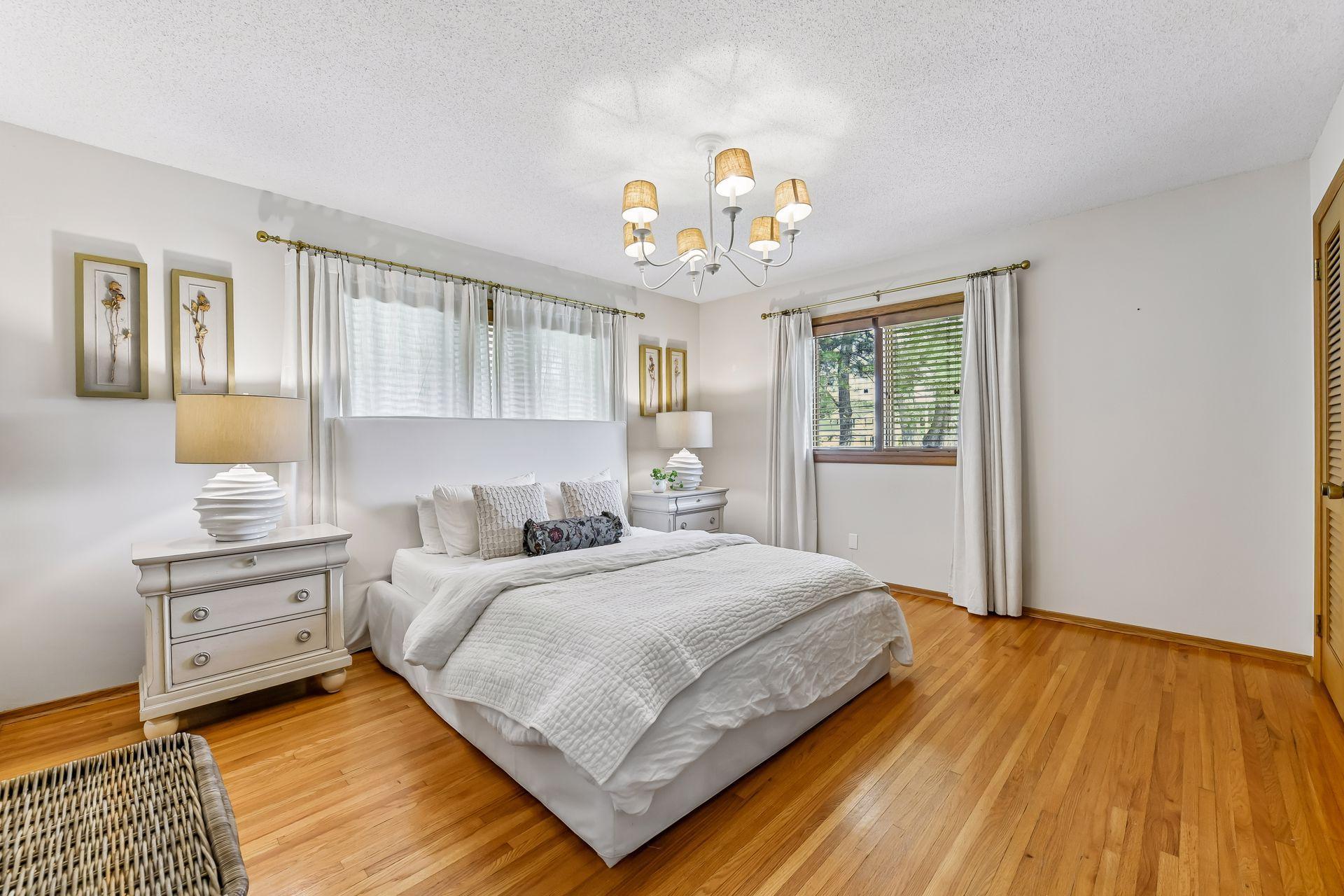 The main level features a primary bedroom with private three-quarter bathroom, two additional bedrooms, and a full bathroom.