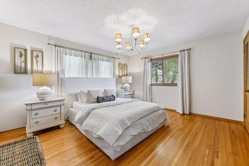 The main level features a primary bedroom with private three-quarter bathroom, two additional bedrooms, and a full bathroom.