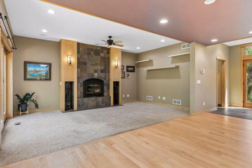 High-end finishes with maple millwork, wood-burning fireplace with slate facade.