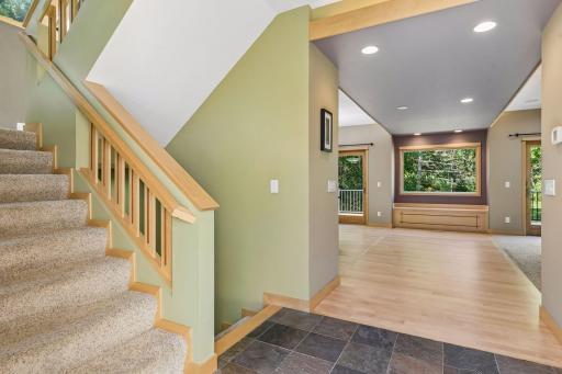 A view into the living area from the front entry. Maple railings with cherry inlay accents.