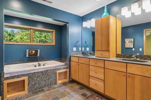 Dual sinks with built-in vanity for abundant storage. Cozy nook to relax in the jetted tub.