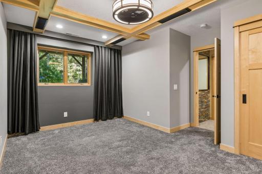 Design this room to suit your lifestyle as a 3rd bedroom/entertainment/family room. Maple beams with built-in speakers and ceiling light/fan.