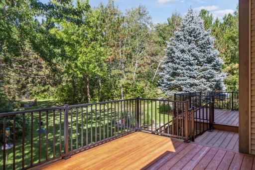 Stairs lead from the deck to the backyard.