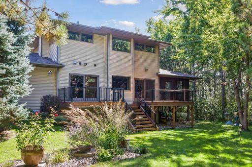 The deck faces west to enjoy sunset views with plenty of shade trees.