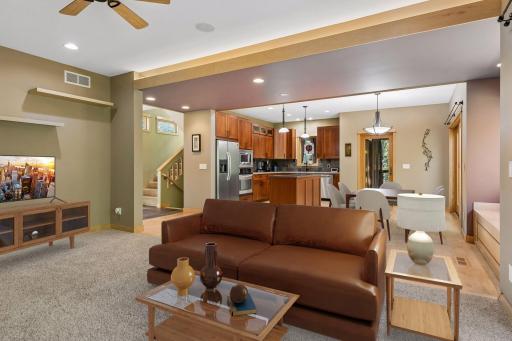 Great room space ideal for hosting, with a living room, dining room and kitchen. Virtually staged furniture