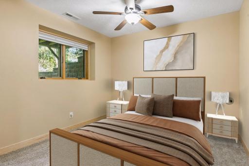 Lower Level Bedroom #3 is spacious with a lookout window.- virtually staged.