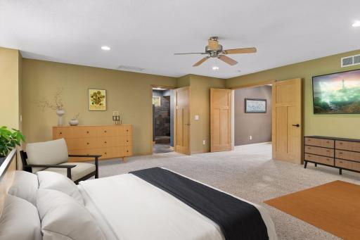 The oversized primary bedroom on the upper level provides privacy and full bath, walk-in closet. Virtually staged