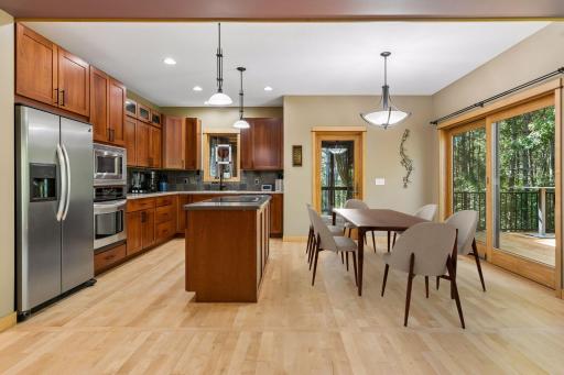 This one is a WOW! Maple hardwood floor with Cherry hardwood cabinetry. Virtually staged furniture