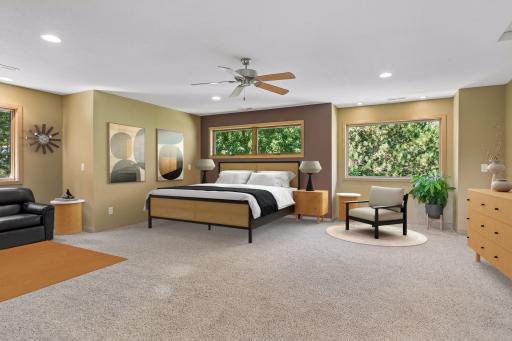 The primary bedroom on the upper level is spacious, 22 X 21, to include a seating area. Virtually staged furniture