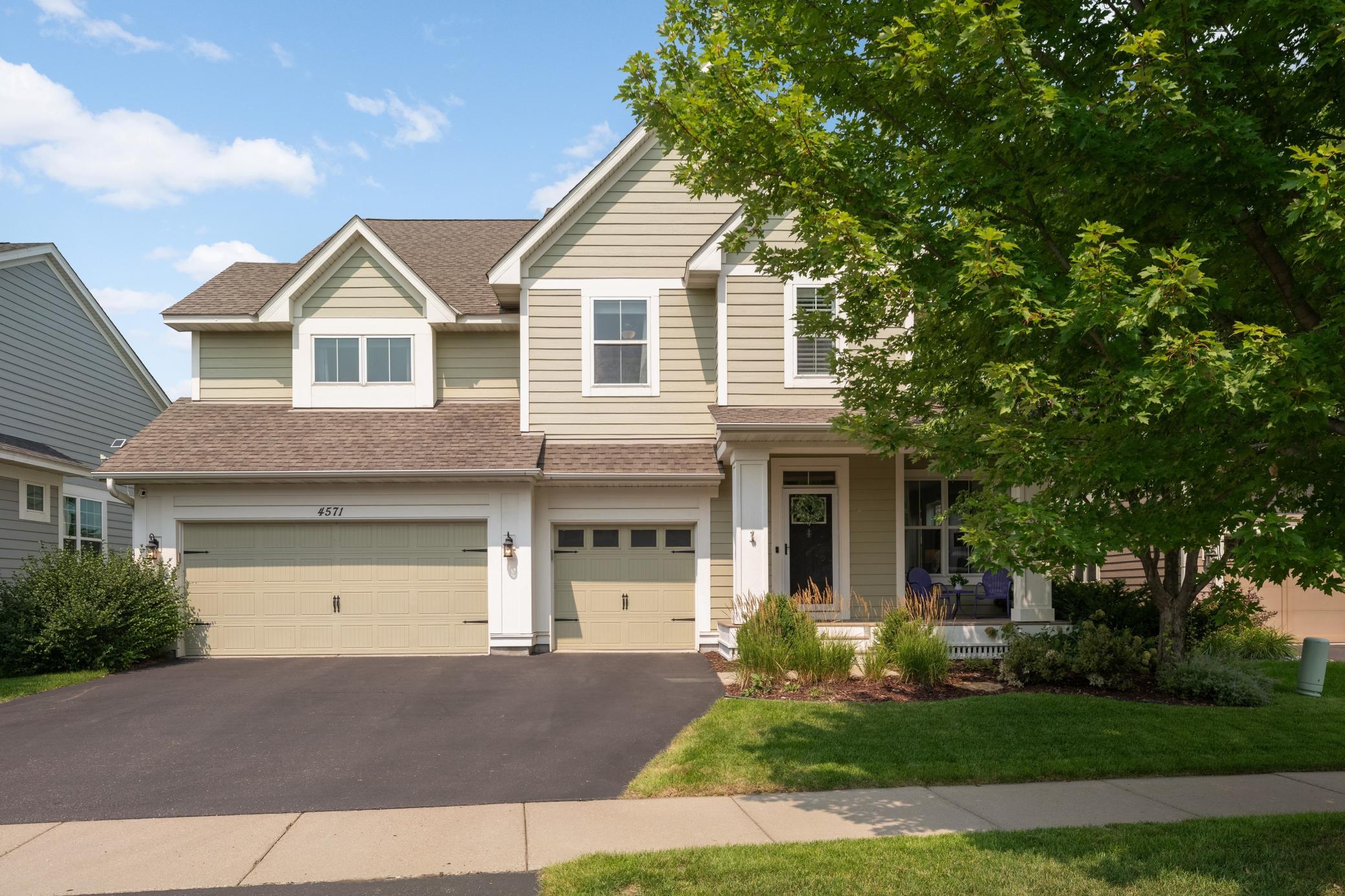 Classic lines, a three-car garage, and all the charm the neighborhood is famous for.