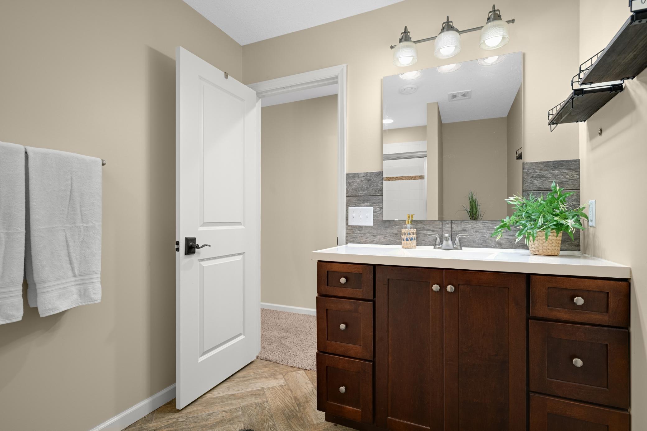 The lower level also features a beautiful three-quarter bathroom.