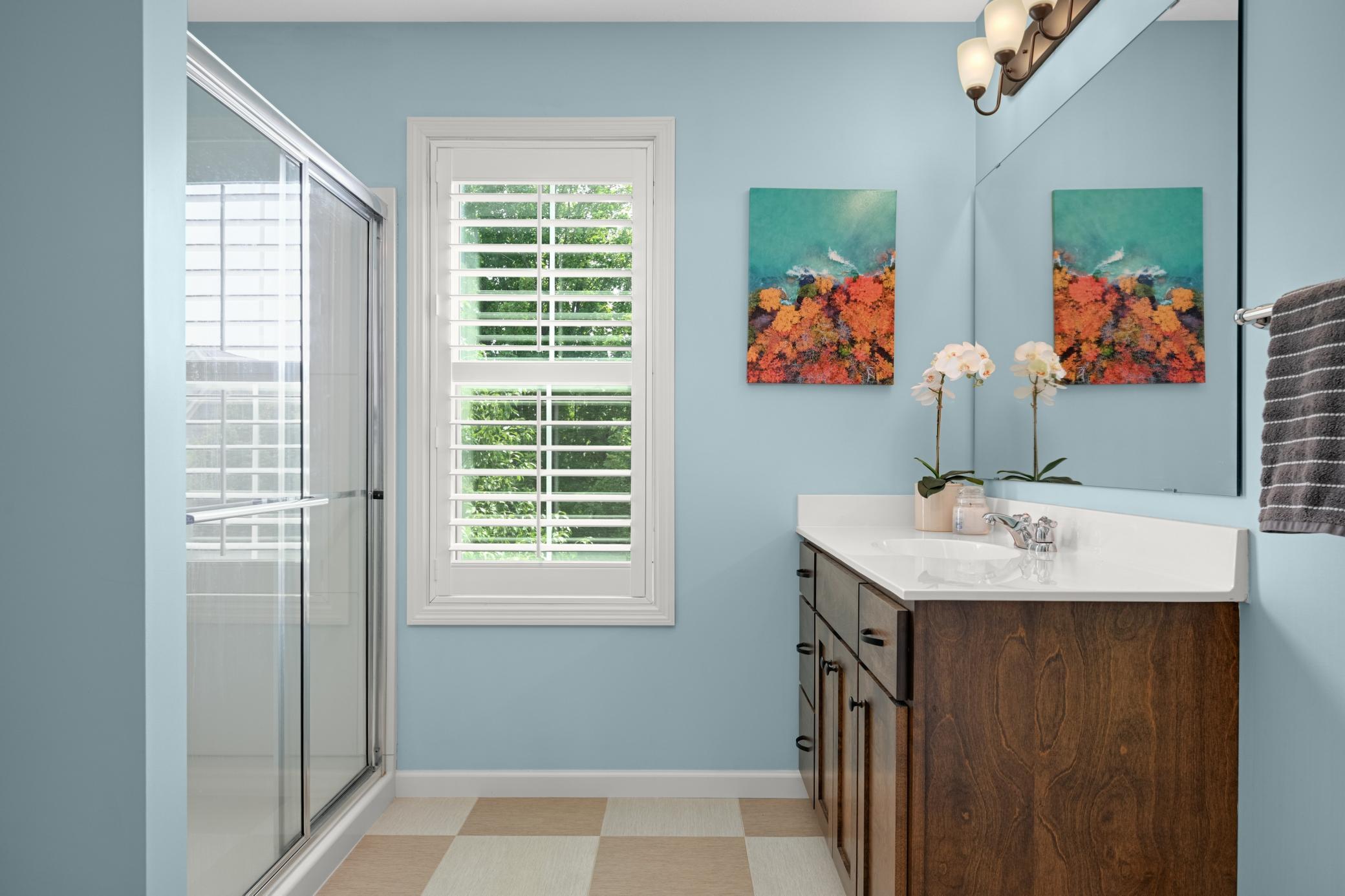 The third bathroom on the upper level also connects to a bedroom, making it a perfect guest room.