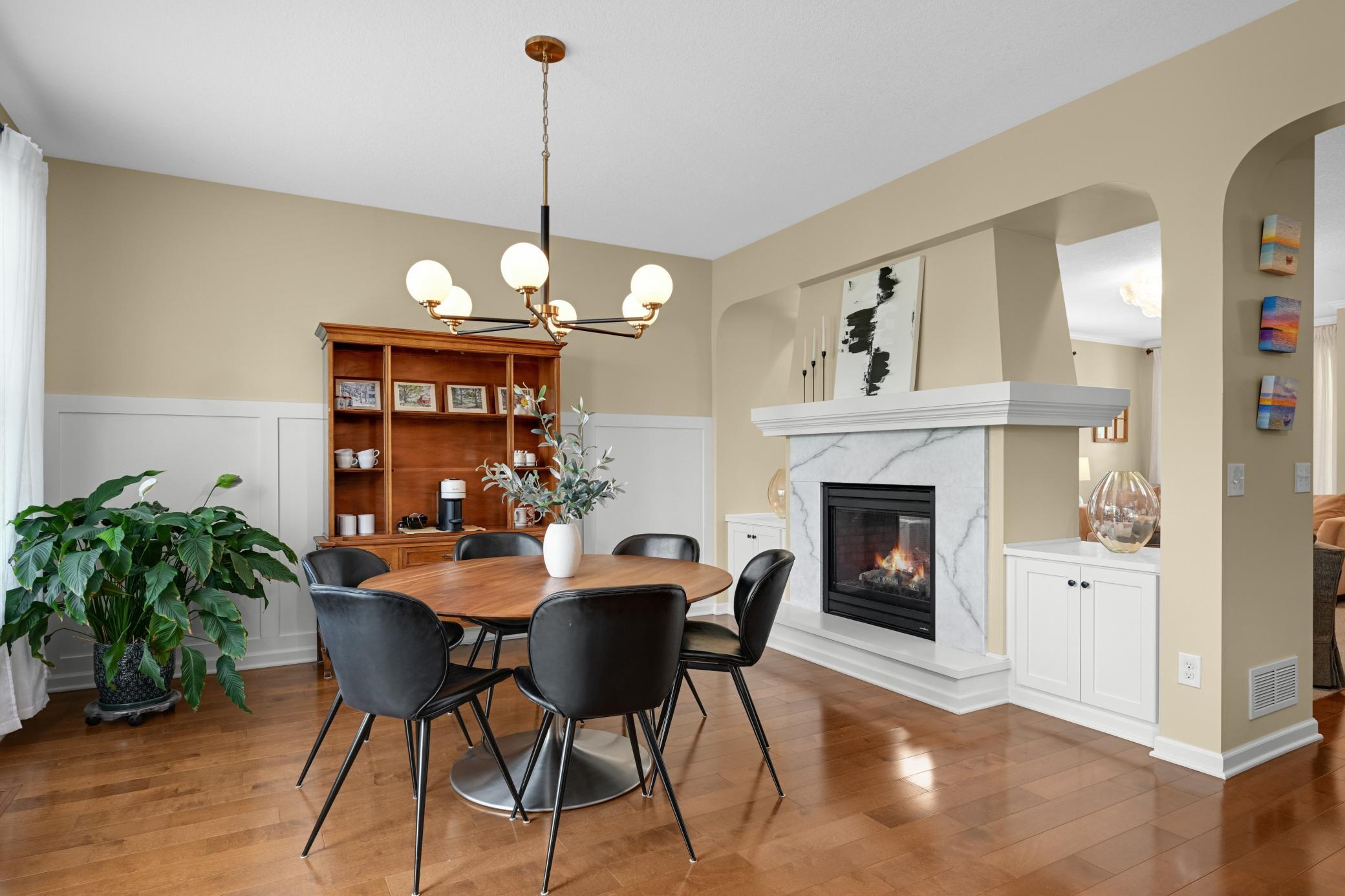The built-ins and 2-sided fireplace anchor the living spaces and create an element of drama