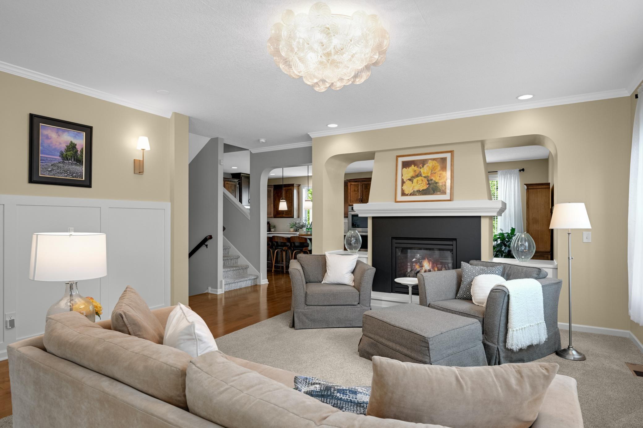 It's all the little details that make a house a home, including wainscoting, a welcoming fireplace, fresh paint, and gorgeous light fixtures.