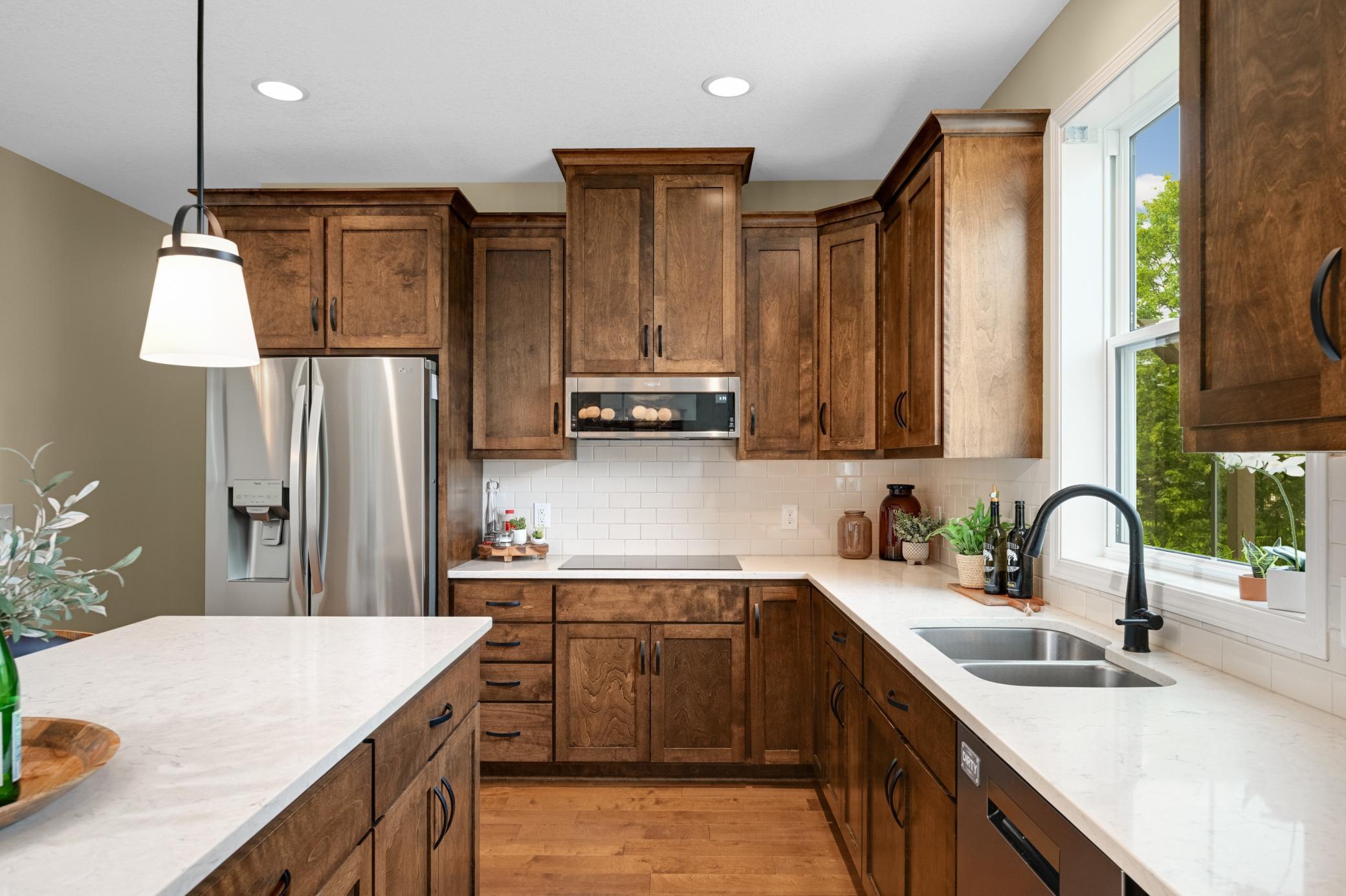 The 42 upper cabinets, quartz countertops and gorgeous backsplash are 10!
