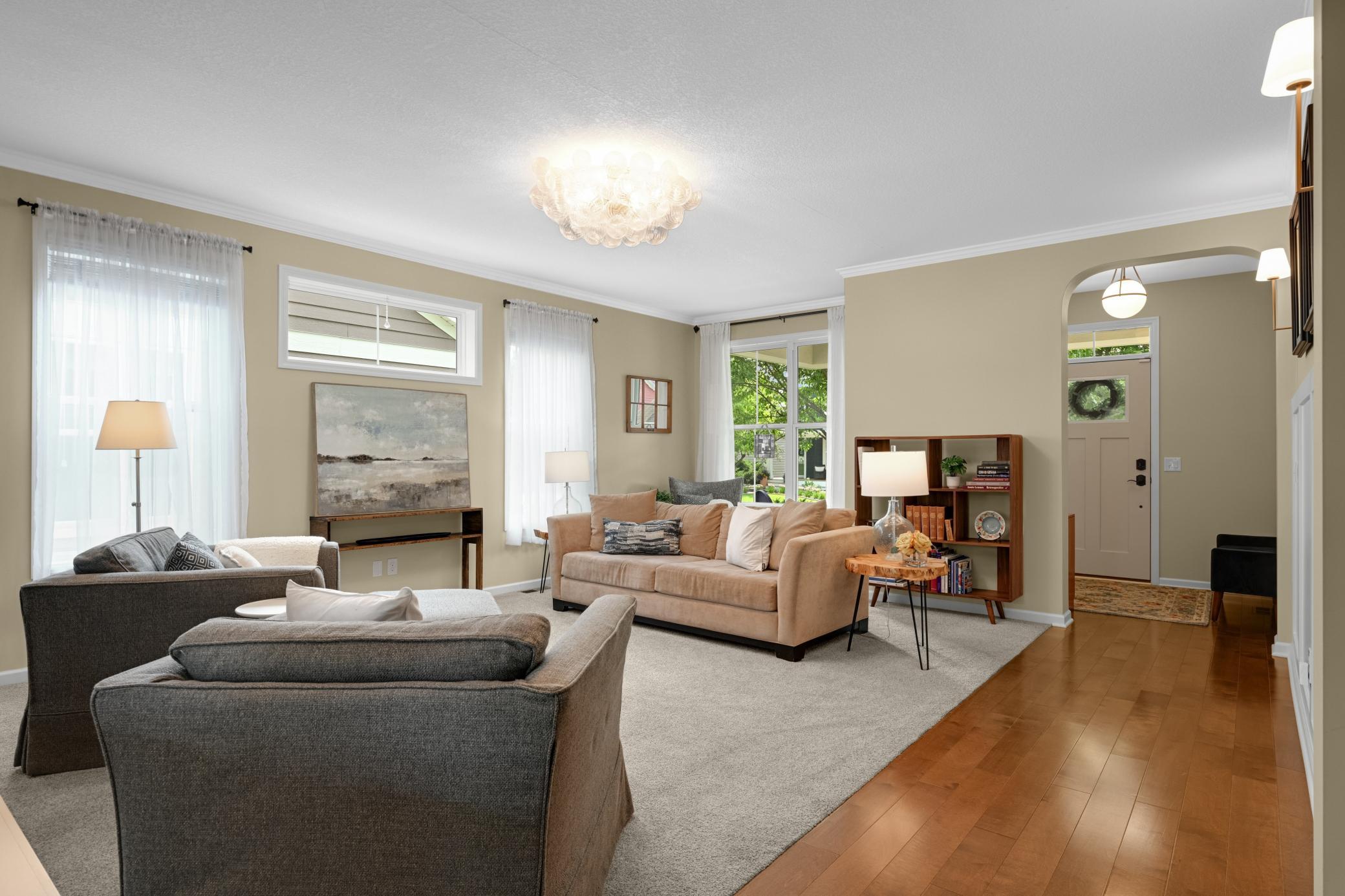 The great room features a brand new gorgeous statement fixture along with a 2-sided fireplace