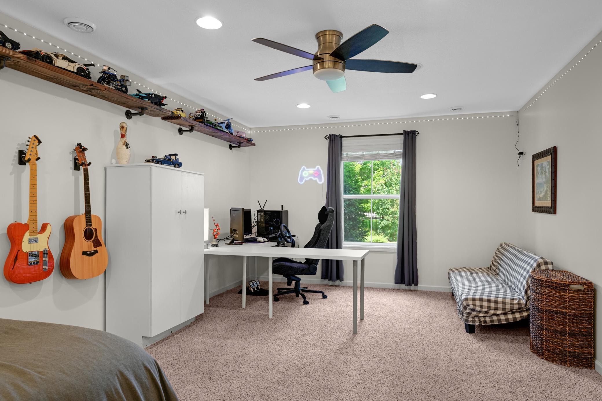 The lower-level bedroom is incredibly spacious and overlooks the backyard.