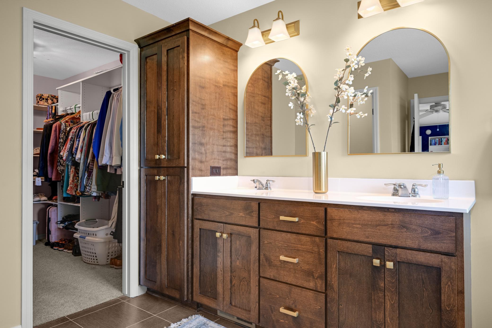 The private primary bath — double sinks and a spa-like feel to start every day right.