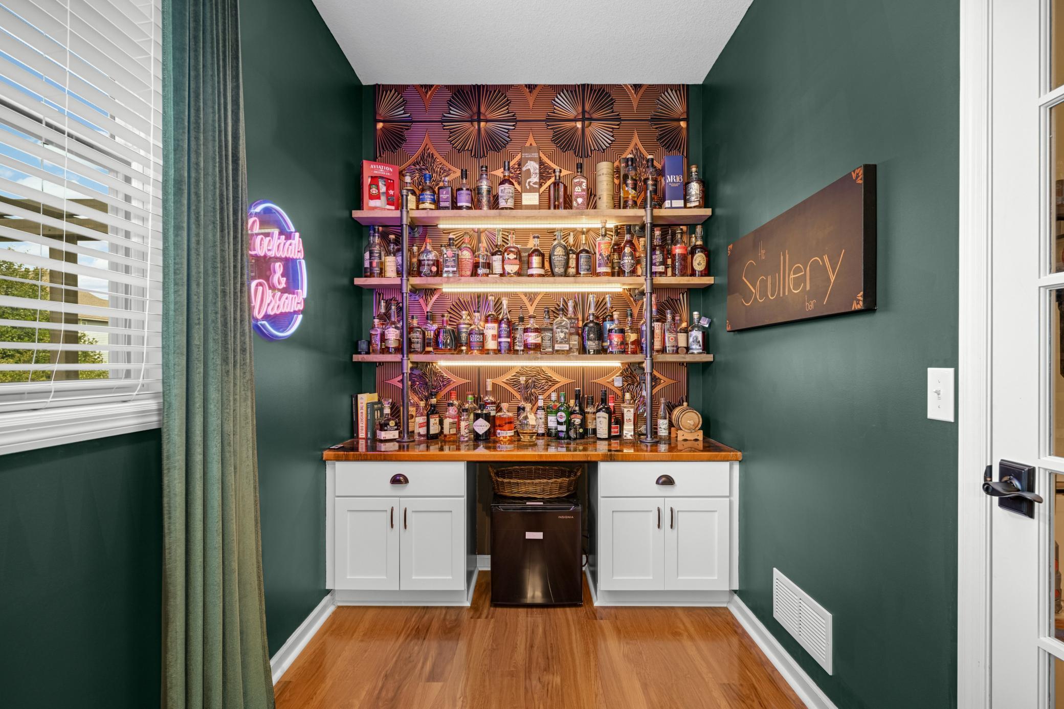 The main floor home office is currently being used as the sexiest speakeasy bar.