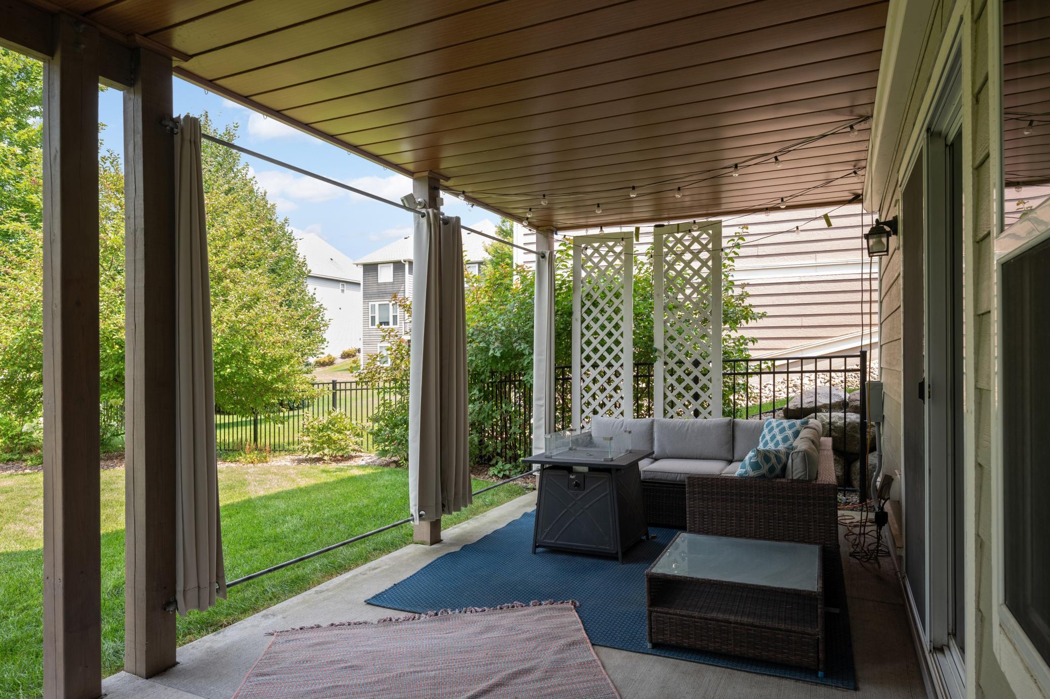 Slide the curtains closed, and you have a private little oasis complete with a fully fenced backyard.