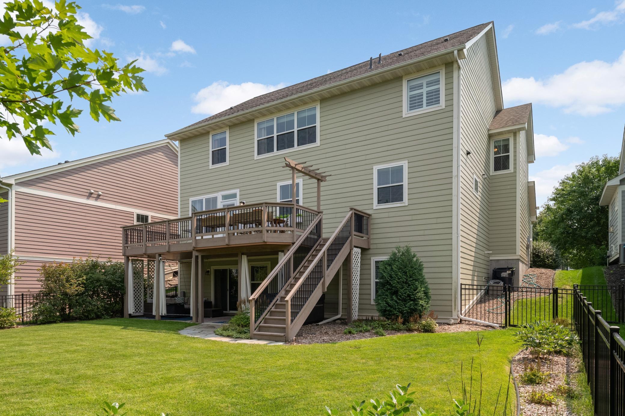 This backyard is what entertaining dreams are made of, with the spacious deck and the lower-level patio. Don't miss the brand new hot tub.