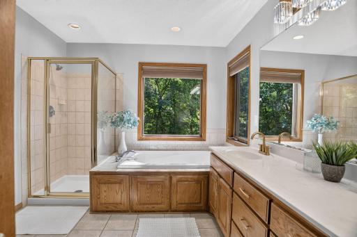 Refreshed primary bath with double sinks and soaking tub.