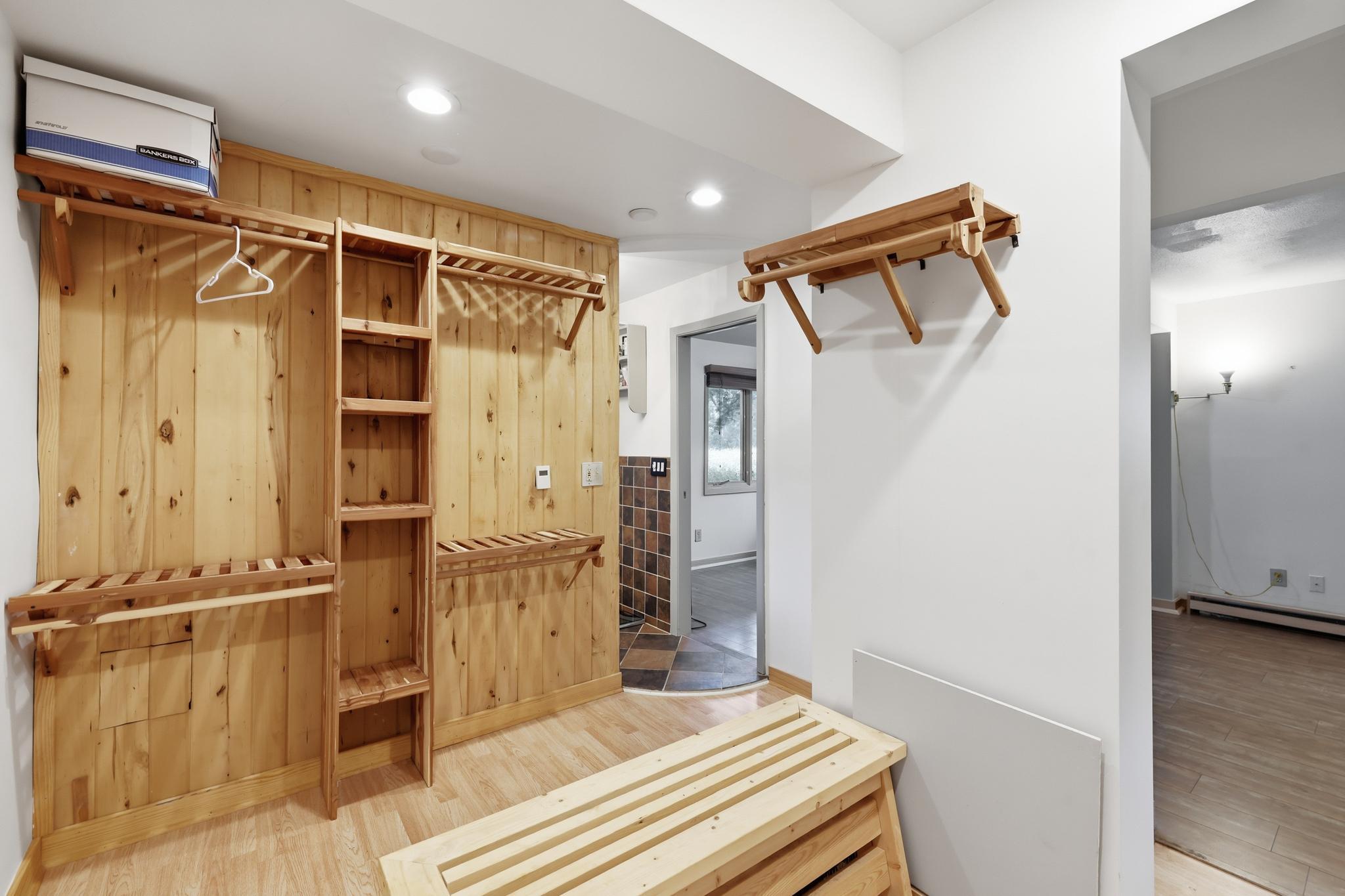 Primary walk-in Closet and Walk-through to Primary Bath